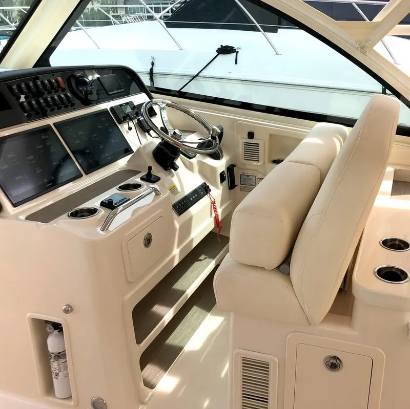 Slide: The Image of 2023 Grady-White Freedom 375 helm with modern controls and comfortable seating. - 36