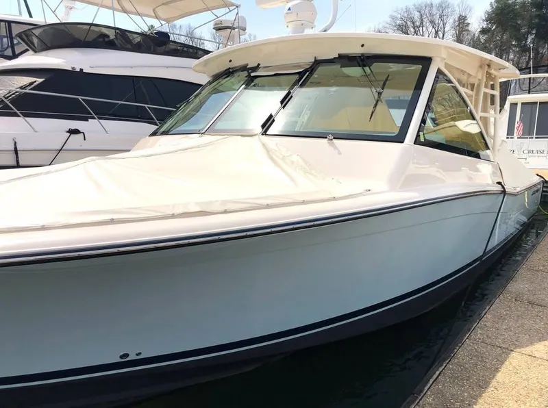 Slide: The Image of 2023 Grady-White Freedom 375 boat docked, showcasing sleek design and modern features. - 38