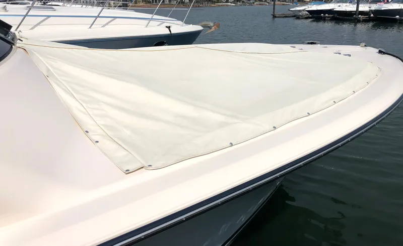 Slide: The Image of 2023 Grady-White Freedom 375 boat with covered bow, docked in marina. - 4