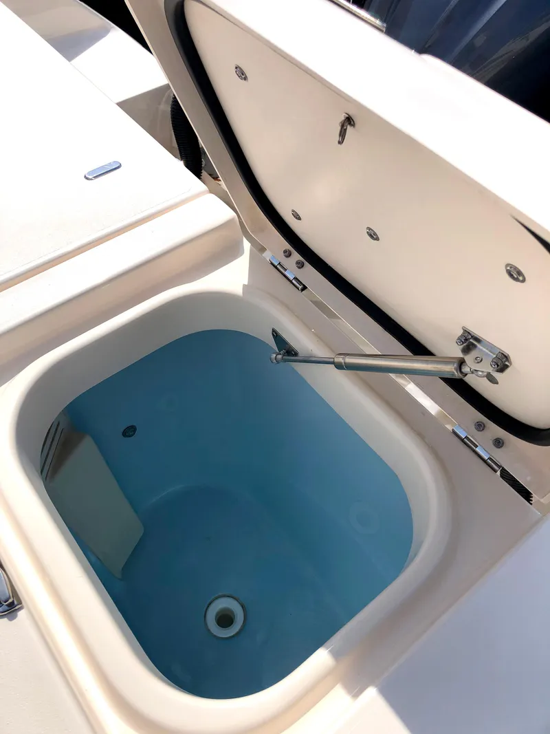 Slide: The Image of Open storage compartment on 2023 Grady-White Freedom 375 boat. - 6