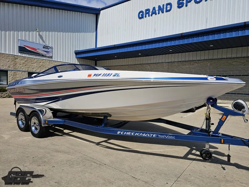 Slide: The Image of 2012 Checkmate ZT 230 BR speedboat on trailer outside Grand Sport Center. - 12