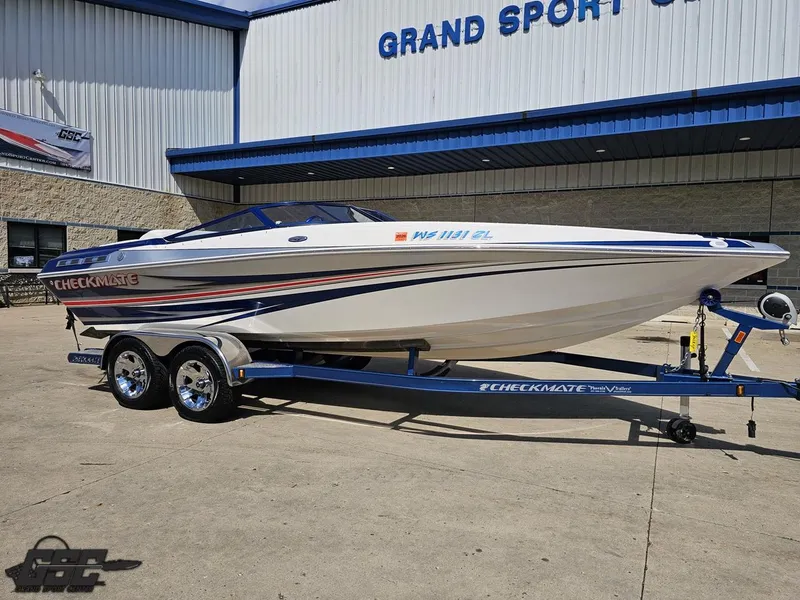 Slide: The Image of 2012 Checkmate ZT 230 BR speedboat on trailer, parked outside Grand Sport Center. - 13