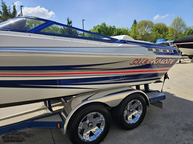 Slide: The Image of 2012 Checkmate ZT 230 BR boat on trailer, featuring sleek design and vibrant graphics. - 21