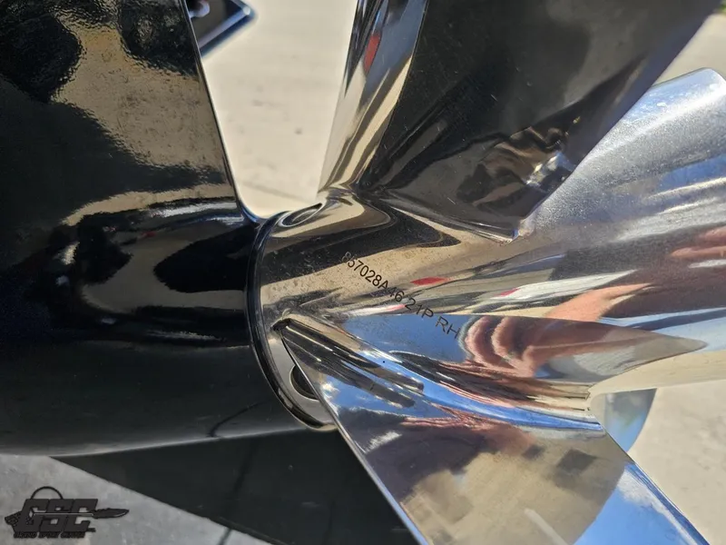 Slide: The Image of Close-up of a 2012 Checkmate ZT 230 BR boat propeller, reflecting sunlight. - 32