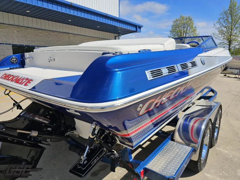 Slide: The Image of 2012 Checkmate ZT 230 BR boat in blue and white on a trailer. - 35