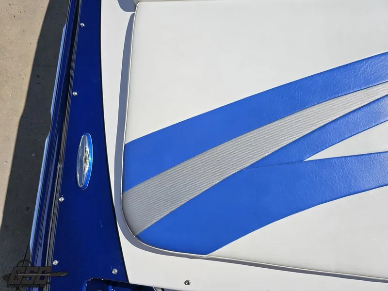 Slide: The Image of 2012 Checkmate ZT 230 BR boat seat with blue and white upholstery design. - 42