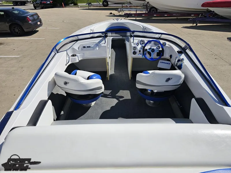 Slide: The Image of 2012 Checkmate ZT 230 BR boat interior with white seating and blue accents. - 45