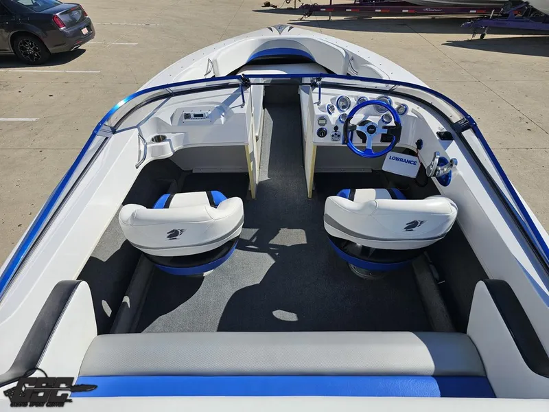 Slide: The Image of Interior of 2012 Checkmate ZT 230 BR boat with blue and white seating. - 46