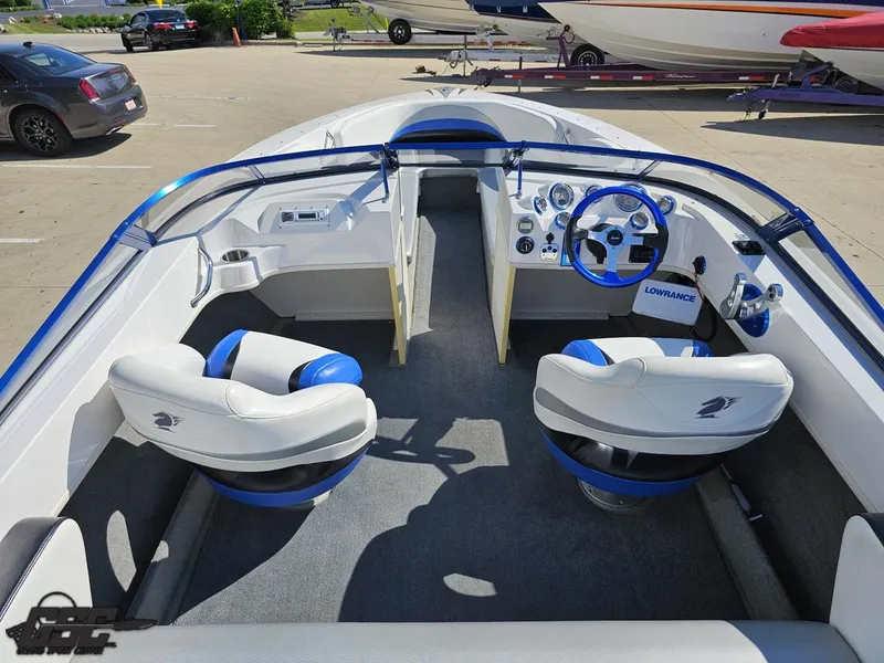 Slide: The Image of Interior of 2012 Checkmate ZT 230 BR boat with blue and white seating. - 47