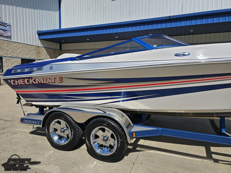 Slide: The Image of 2012 Checkmate ZT 230 BR boat on trailer, featuring sleek design and vibrant graphics. - 7