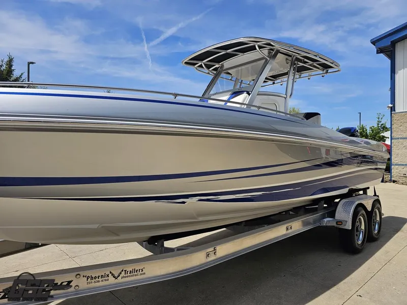 Slide: The Image of 2017 Sunsation 29 CCX boat on trailer, sleek design, blue accents, sunny day. - 15