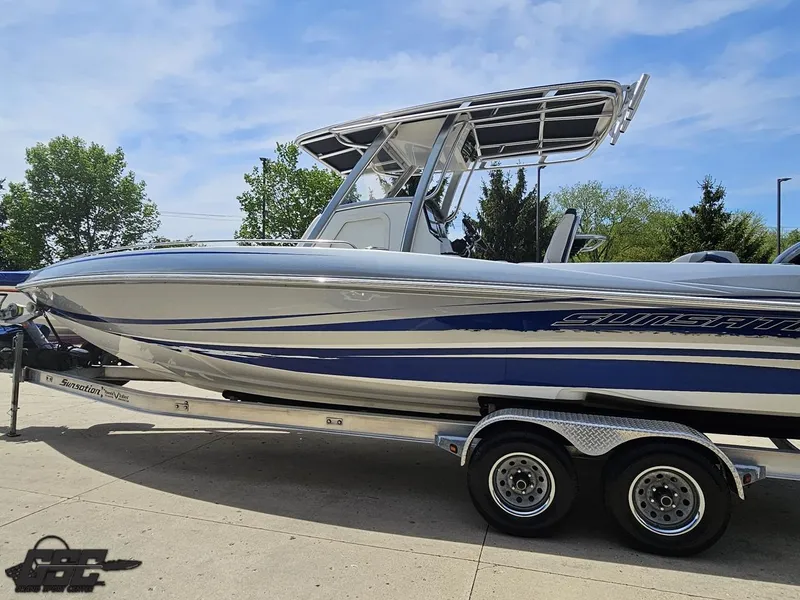 Slide: The Image of 2017 Sunsation 29 CCX boat on trailer, sleek design, blue and silver accents. - 19