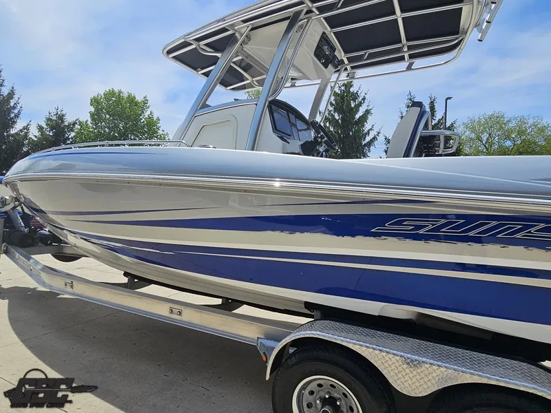 Slide: The Image of 2017 Sunsation 29 CCX boat on trailer, featuring sleek blue and silver design. - 20