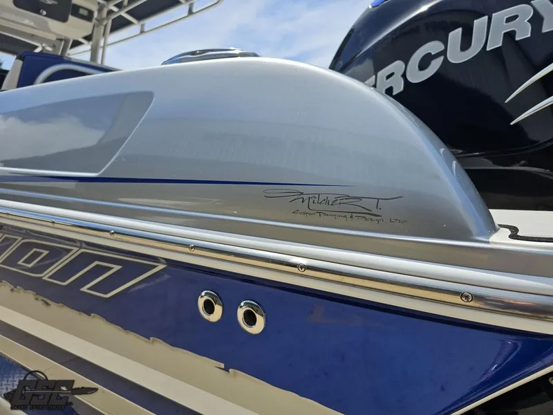 Slide: The Image of 2017 Sunsation 29 CCX boat with Mercury engine, blue and silver design. - 24