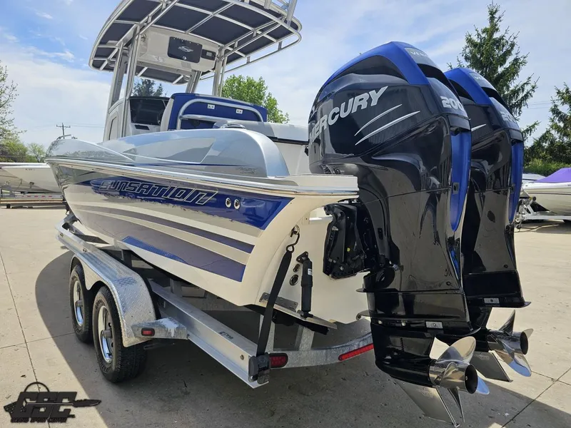 Slide: The Image of 2017 Sunsation 29 CCX boat with dual Mercury engines on a trailer. - 25