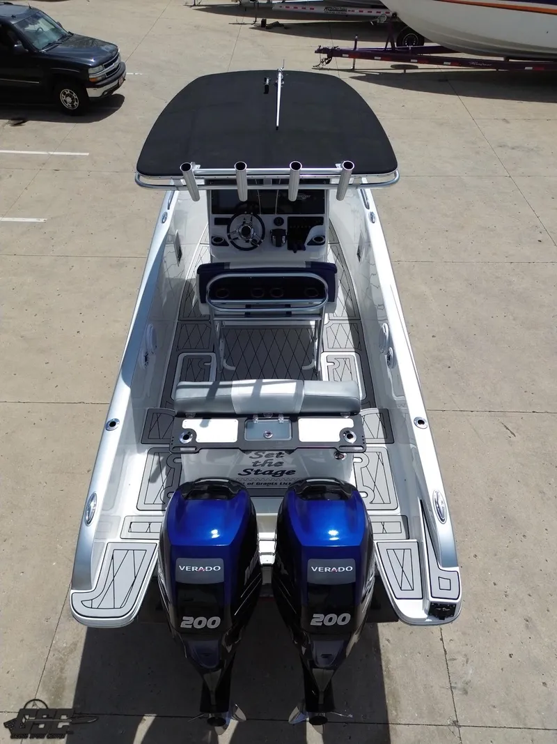 Slide: The Image of 2017 Sunsation 29 CCX boat with dual Mercury Verado 200 engines, docked on concrete. - 33