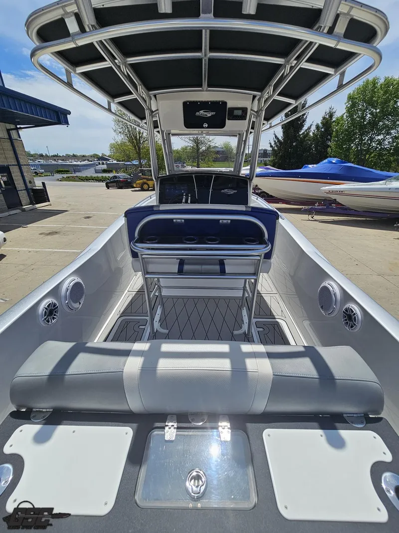 Slide: The Image of 2017 Sunsation 29 CCX boat with sleek interior and modern design, docked outdoors. - 37