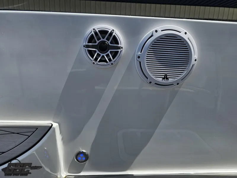 Slide: The Image of 2017 Sunsation 29 CCX boat speakers and light on sleek white surface. - 45
