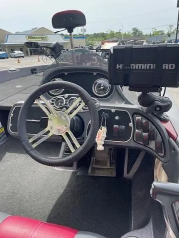 Slide: The Image of 2011 Ranger 188 VX boat cockpit with steering wheel and Humminbird fish finder. - 10