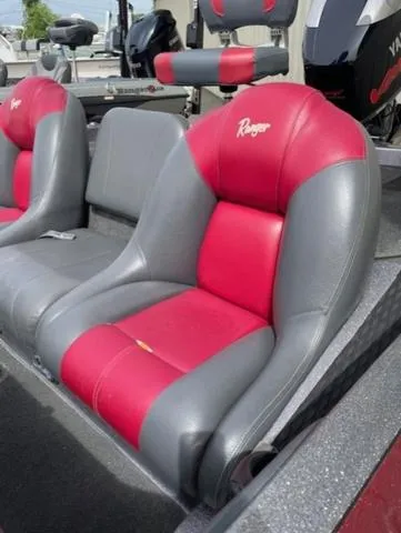 Slide: The Image of Red and gray seats in a 2011 Ranger 188 VX boat. - 12