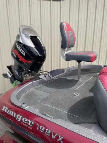 Slide: The Image of 2011 Ranger 188 VX boat with Yamaha motor and red-gray seating. - 16