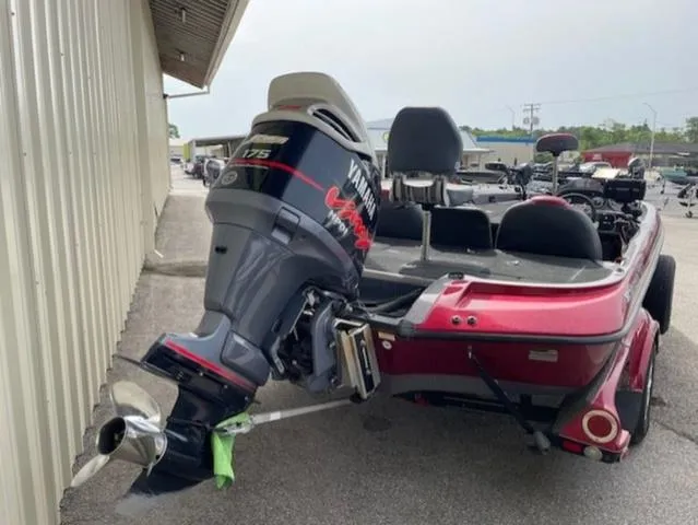 Slide: The Image of 2011 Ranger 188 VX boat with Yamaha 175 engine, parked outdoors. - 17