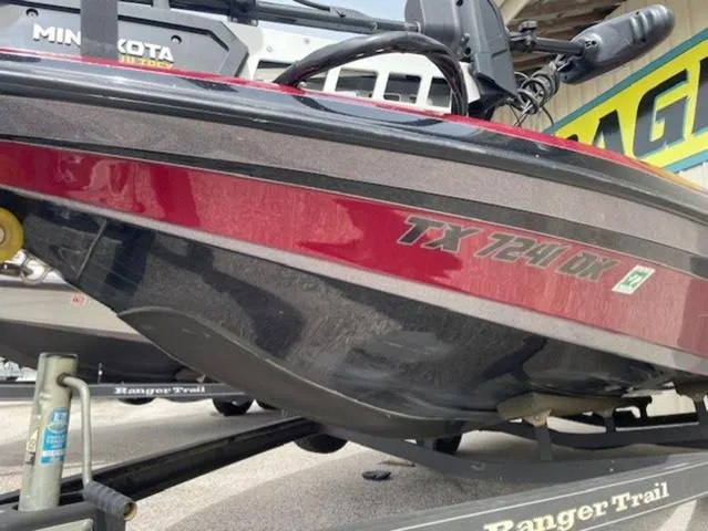 Slide: The Image of 2011 Ranger 188 VX boat on trailer, featuring red and black hull design. - 8