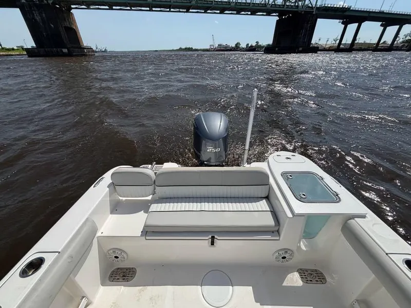 Slide: The Image of 2021 Sea Fox 248 Commander boat on water, view of deck and outboard motor. - 10