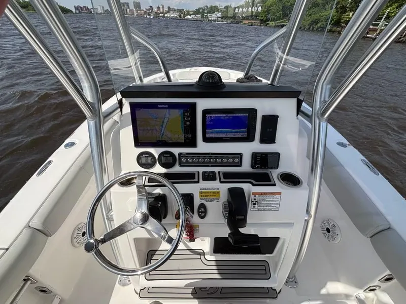 Slide: The Image of 2021 Sea Fox 248 Commander boat console with navigation screens and steering wheel. - 6
