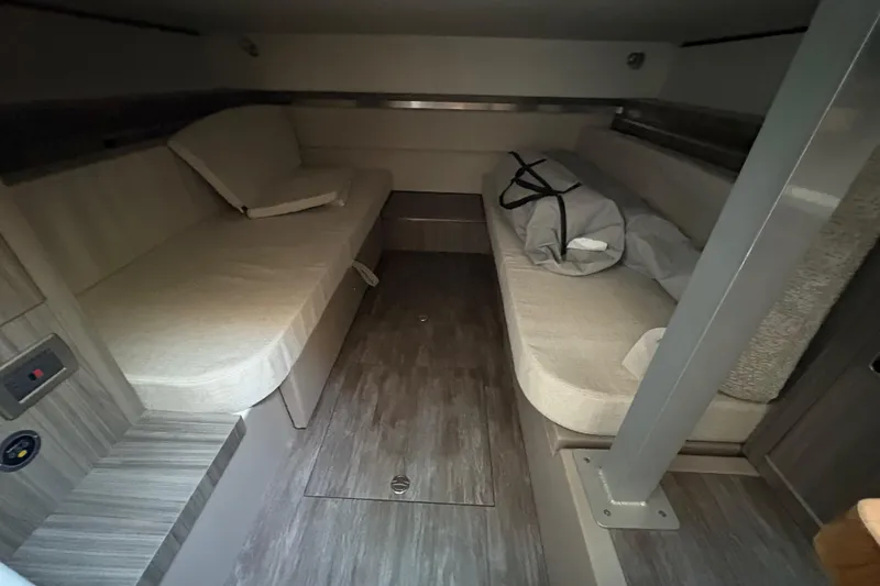 Slide: The Image of Interior cabin of 2026 Sea Ray Sundancer 320 Outboard with cozy seating and modern design. - 20