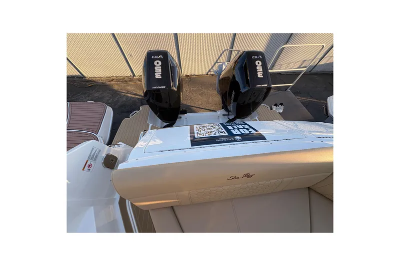 Slide: The Image of 2026 Sea Ray Sundancer 320 Outboard with dual Mercury engines, rear view. - 5
