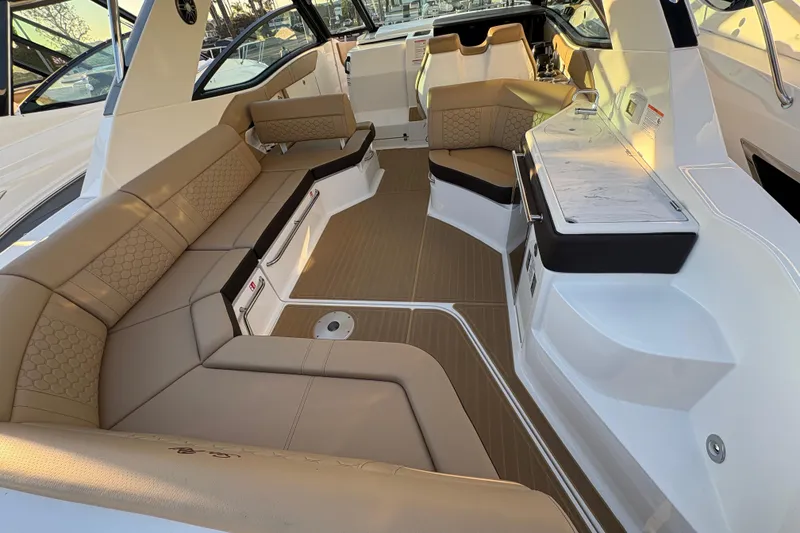Slide: The Image of 2026 Sea Ray Sundancer 320 Outboard interior with luxurious seating and modern design. - 6