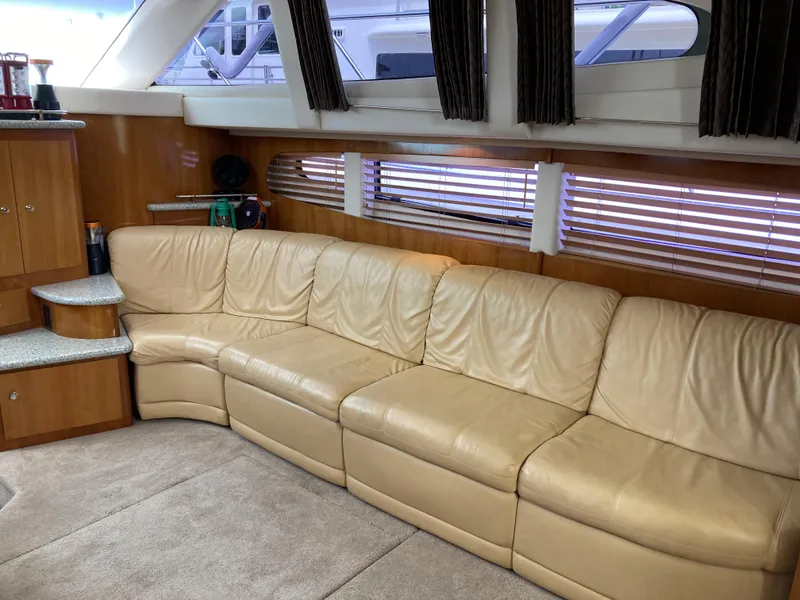Slide: The Image of Luxurious interior of 2001 Carver 396 Aft Cabin with beige leather seating. - 26