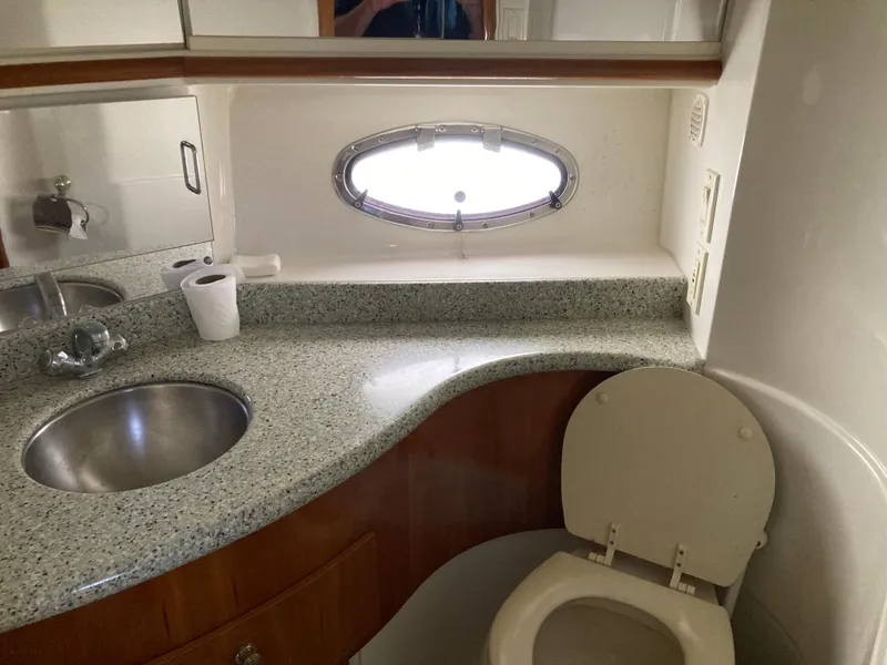 Slide: The Image of Bathroom interior of 2001 Carver 396 Aft Cabin yacht with sink and toilet. - 42
