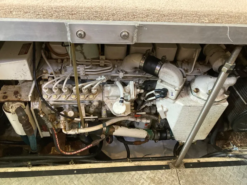 Slide: The Image of Engine compartment of a 2001 Carver 396 Aft Cabin boat, showcasing mechanical components. - 45