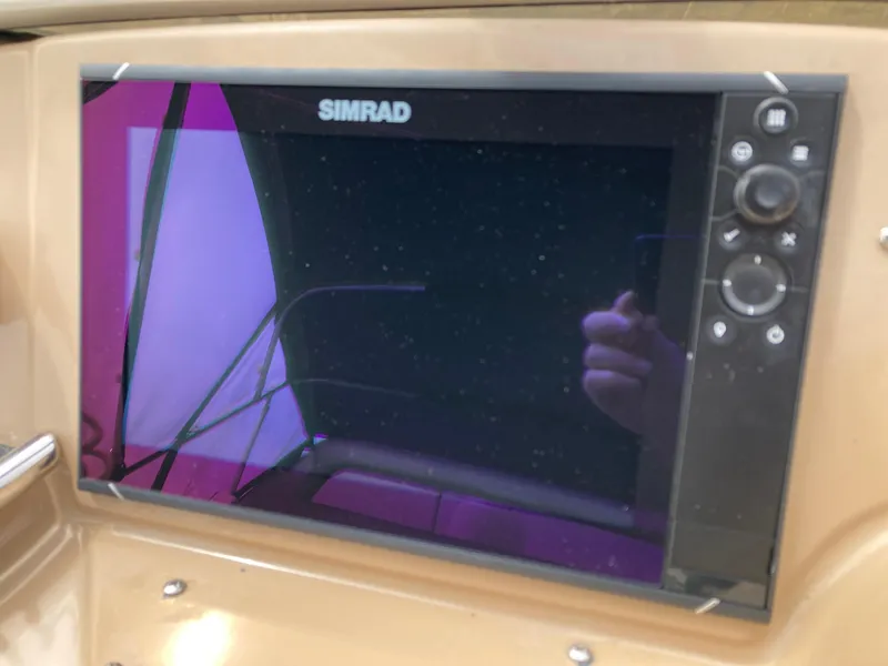 Slide: The Image of Simrad marine display on 2001 Carver 396 Aft Cabin yacht dashboard. - 15