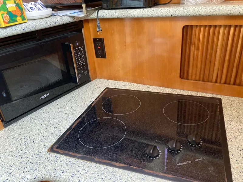 Slide: The Image of Kitchen area in 2001 Carver 396 Aft Cabin with stove and microwave. - 31