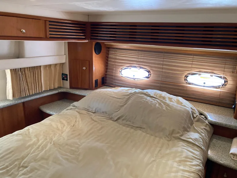 Slide: The Image of 2001 Carver 396 Aft Cabin bedroom with cozy bed and wooden interior. - 36