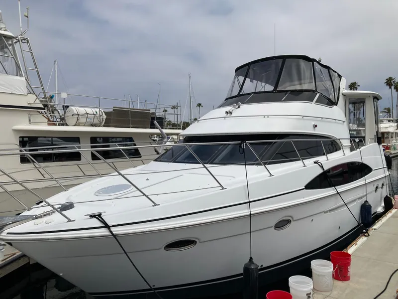Slide: The Image of 2001 Carver 396 Aft Cabin yacht docked at marina, featuring sleek design and spacious cabin. - 6