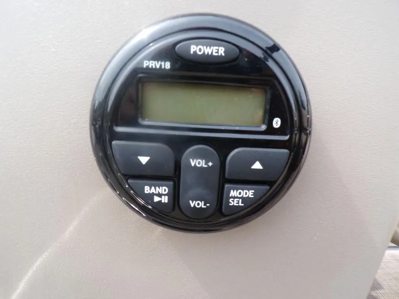 Slide: The Image of Control panel of 2021 Sun Tracker BASS BUGGY® 16 DLX boat with buttons and display. - 16