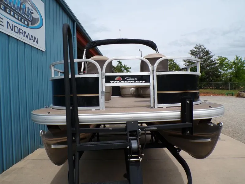 Slide: The Image of 2021 Sun Tracker BASS BUGGY® 16 DLX pontoon boat on trailer, rear view. - 4
