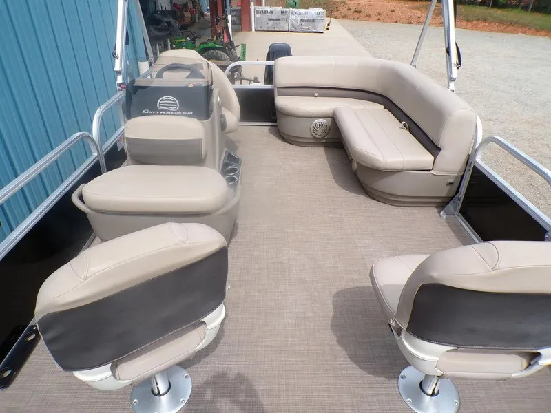 Slide: The Image of 2021 Sun Tracker BASS BUGGY® 16 DLX pontoon boat interior with beige seating. - 9