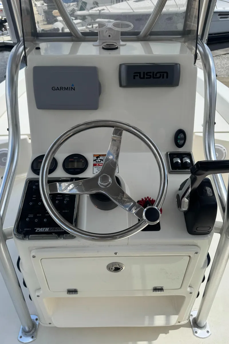 Slide: The Image of 2014 Pathfinder 2200 TRS boat console with Garmin and Fusion systems. - 10