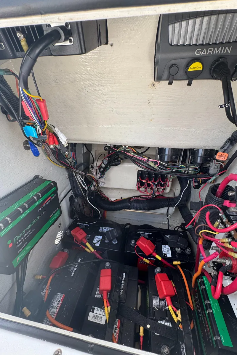 Slide: The Image of 2014 Pathfinder 2200 TRS boat electrical system with batteries and wiring. - 17