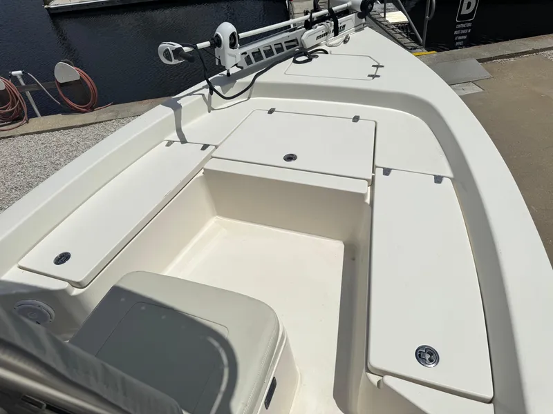 Slide: The Image of 2014 Pathfinder 2200 TRS boat interior with storage compartments and seating. - 6