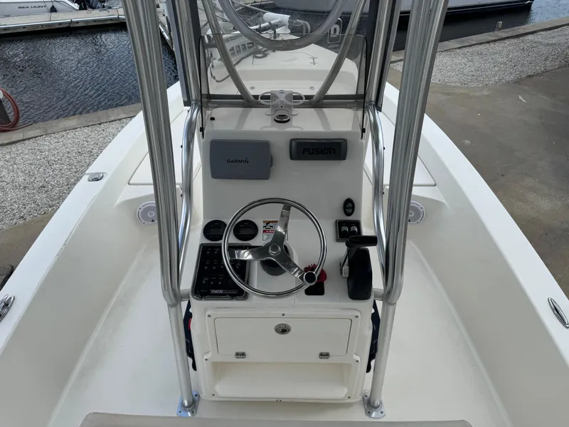 Slide: The Image of Center console of a 2014 Pathfinder 2200 TRS boat with steering wheel and controls. - 7