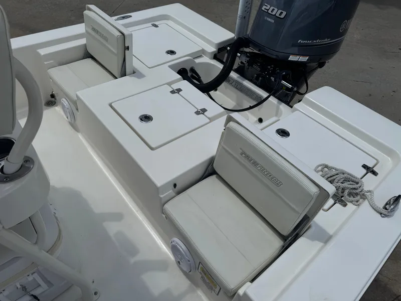 Slide: The Image of 2014 Pathfinder 2200 TRS boat interior with seating and Yamaha 200 engine. - 8