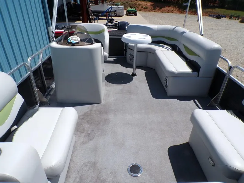 Slide: The Image of 2020 Qwest Edge 816 Cruise boat interior with spacious seating and table. - 11