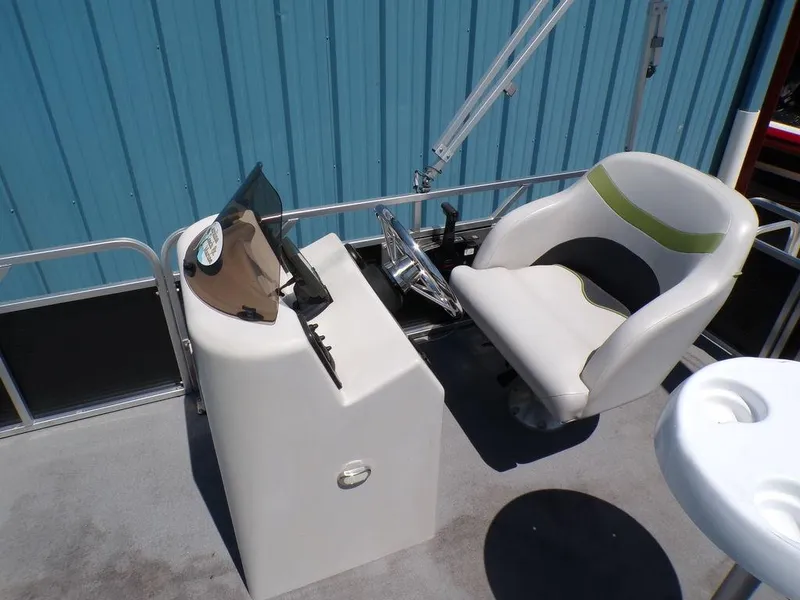 Slide: The Image of Captain's chair and console on 2020 Qwest Edge 816 Cruise boat. - 15