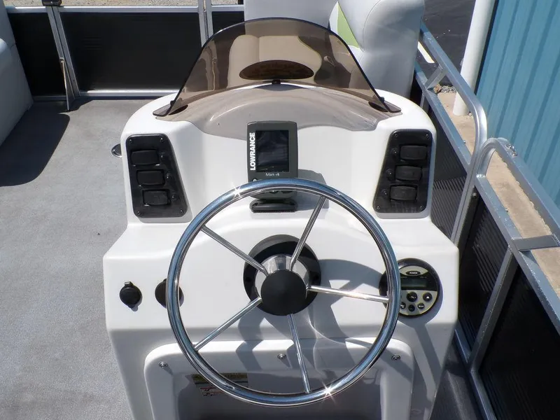 Slide: The Image of 2020 Qwest Edge 816 Cruise boat dashboard with steering wheel and control panel. - 16